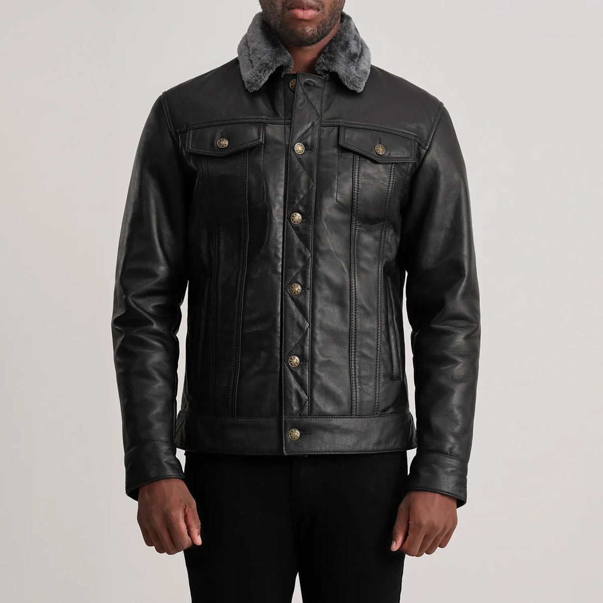 Close-Up Detail of Classic Collar &amp; Button Hardware on Dallis Black Leather Shearling Trucker Jacket