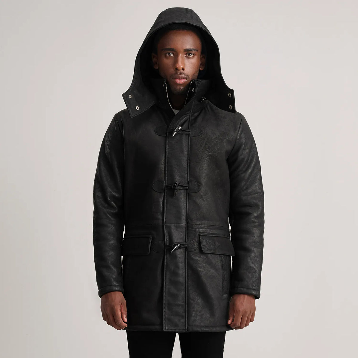 
Close-Up Detail of Band collar & Zipper with Toggle button Hardware on Nolan Black Snuffed Leather Duffle Coat