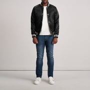 Close-Up Detail of Varsity &amp; Button Hardware on Xander Black Varsity Jacket