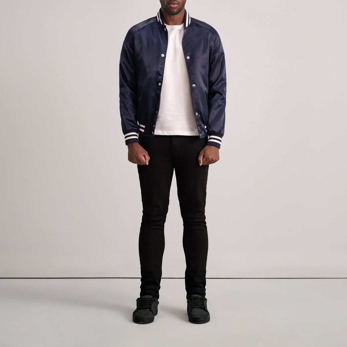 Close-Up Detail of Varsity &amp; Button Hardware on Xander Blue Varsity Jacket